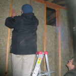 Shin'yu and Phyllis add insulation to the new sanzen room.